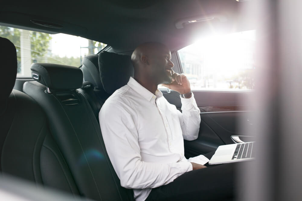 Man making a personal call from the car
