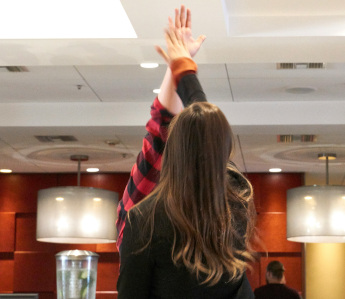 Colleagues high-fiving a shared success