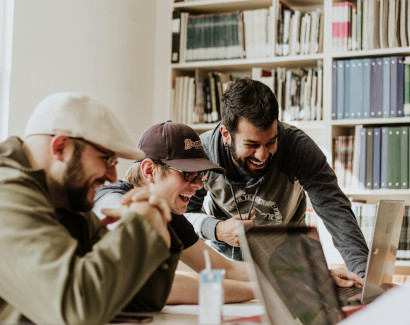 Colleagues joyfully working together an an office