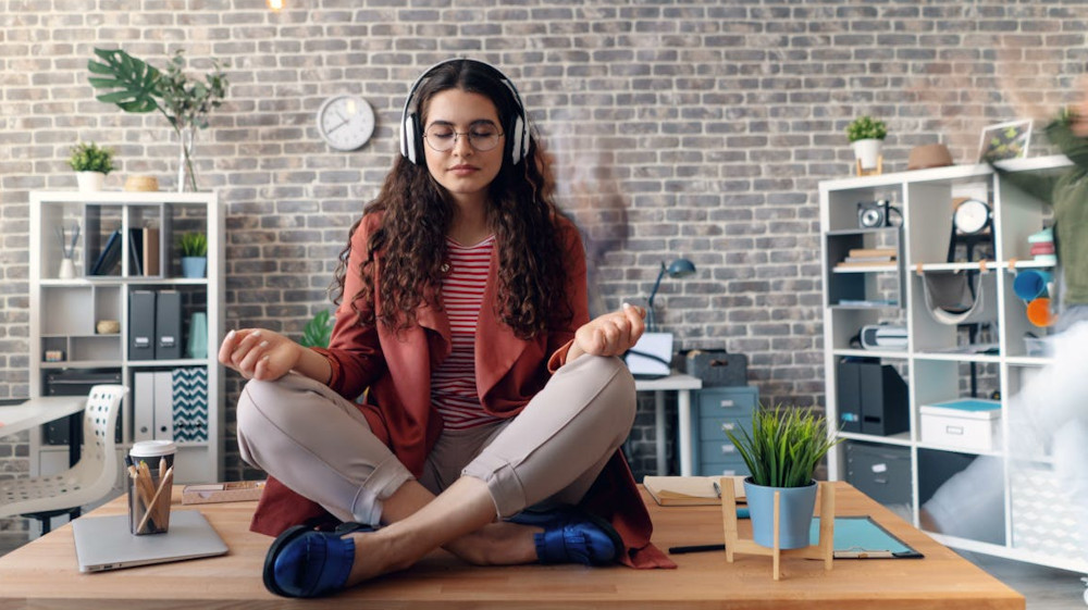 Woman meditating at the office
