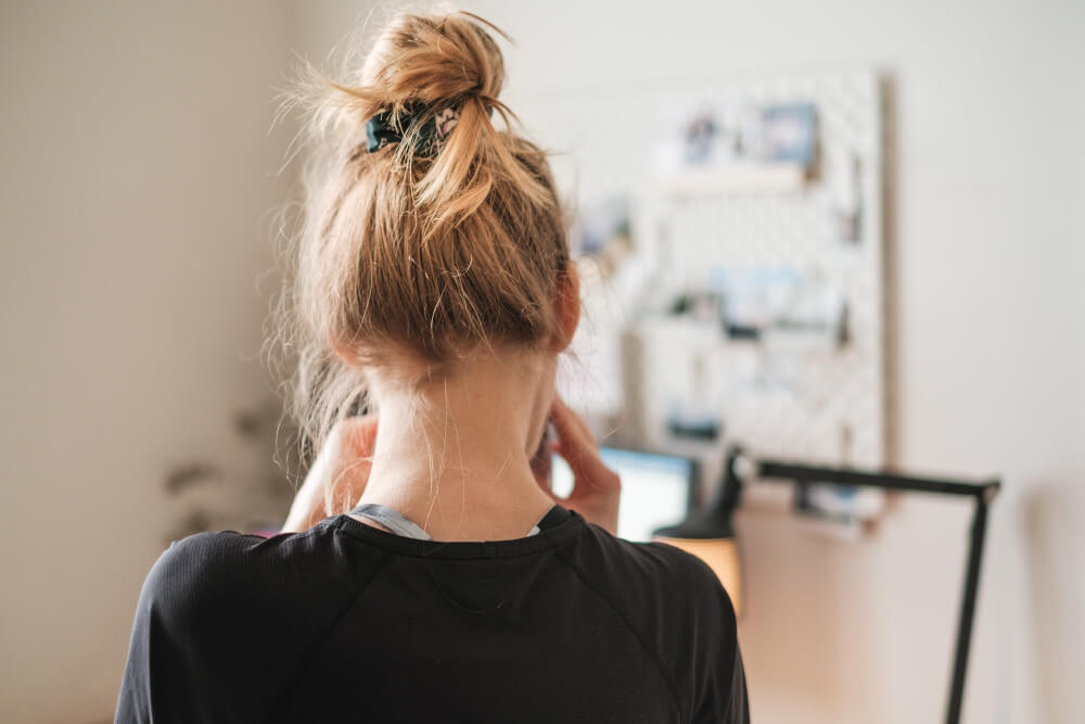 A woman taking a break next to her desk