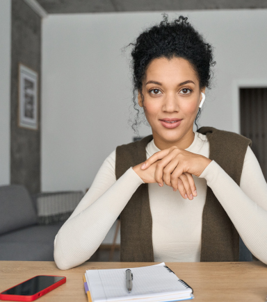 A woman is calmly working from her home