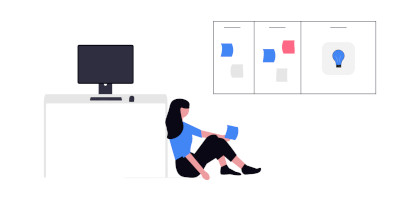 Woman sitting in an office with a PC and a Kanban board