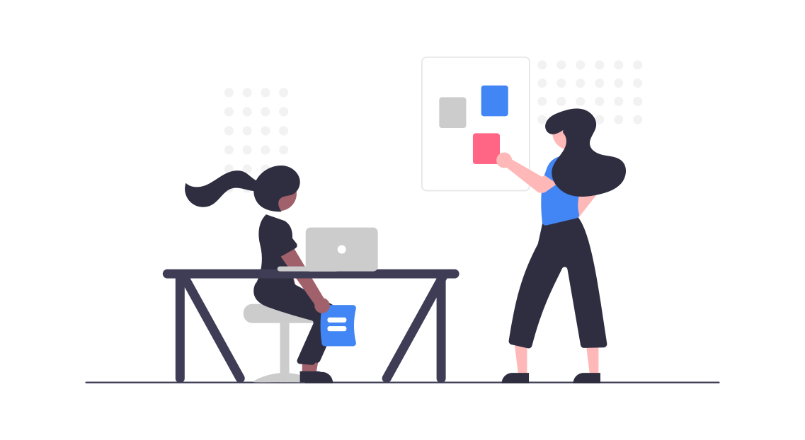 Colleagues working together with a laptop and a visual board